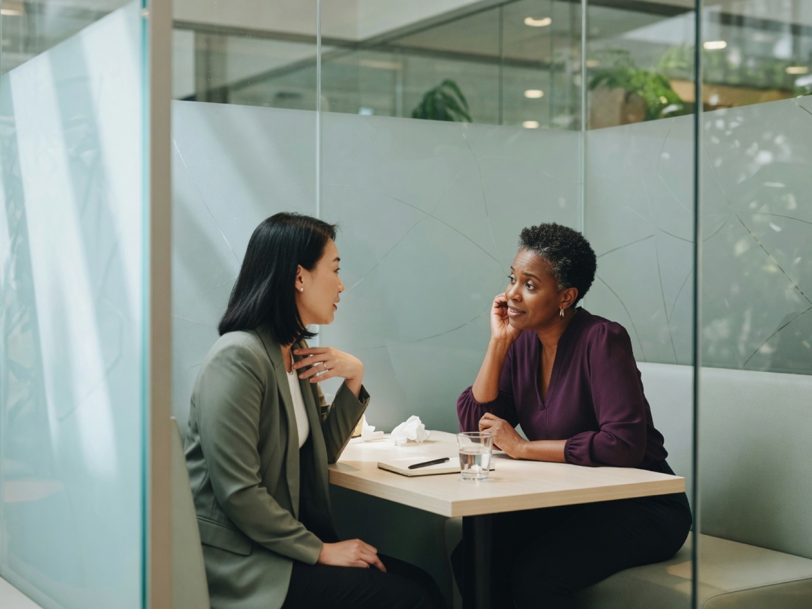 People partner listening in a quiet meeting nook