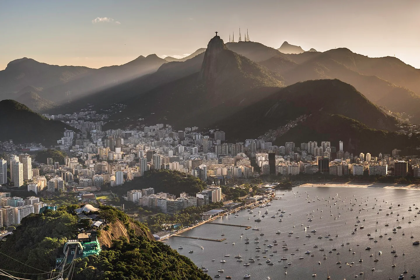 Rio de Janeiro's bay and mountainous skyline in the soft light of sunset, seen from Sugarloaf Mountain.