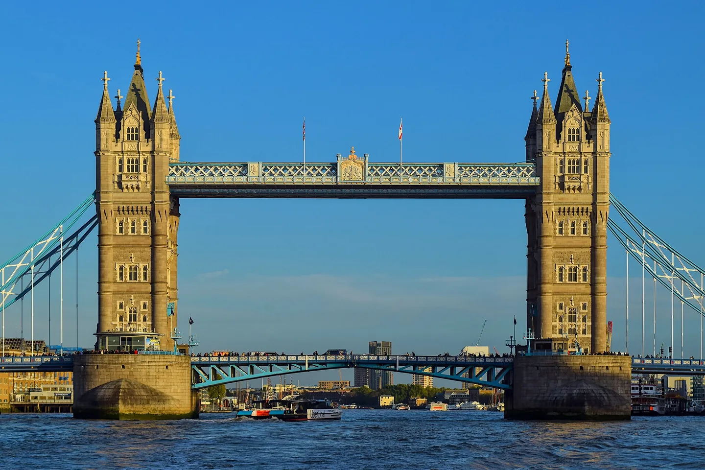 Tower Bridge in warm golden light above the River Thames in London.